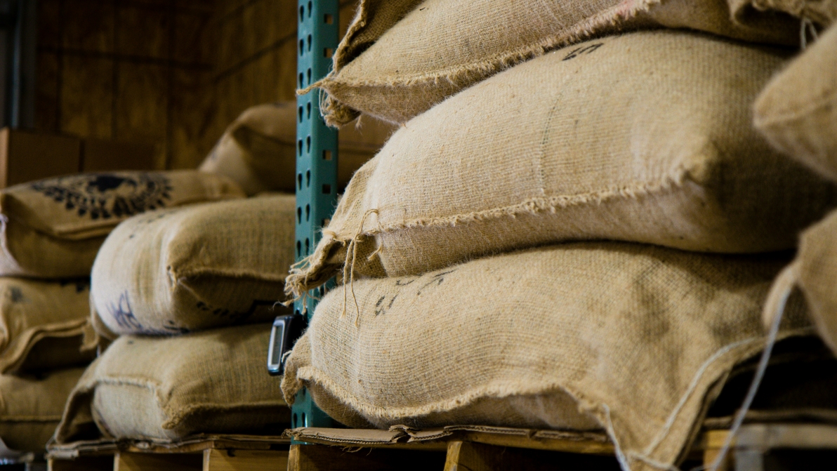 a stack of jute gunny bags in a warehouse